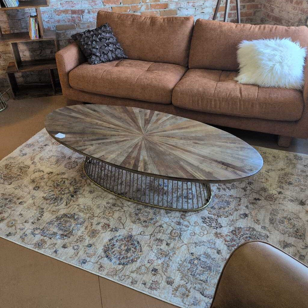 Brown sofa with decorative pillows in a living room setting
