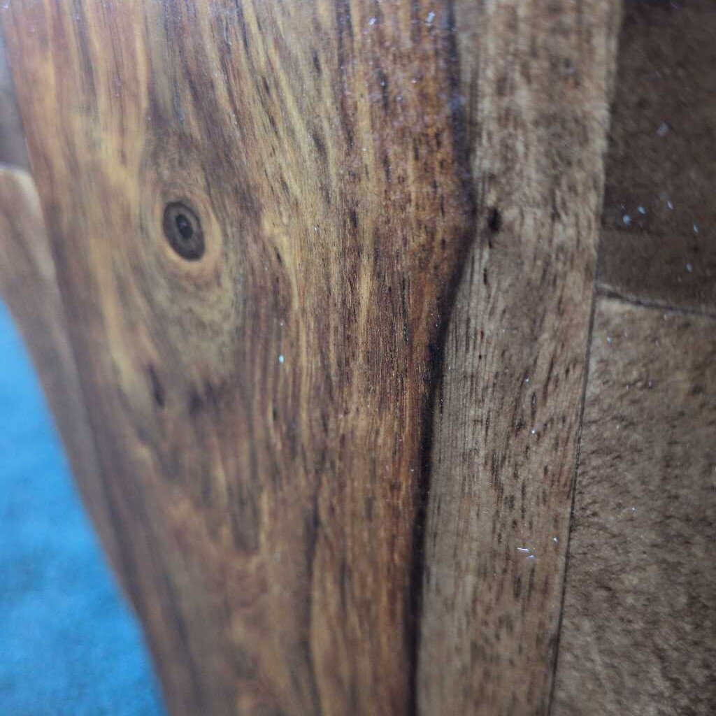 Close-up of a wooden surface with visible grain and texture