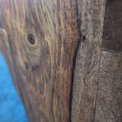 Close-up of a wooden surface with visible grain and texture