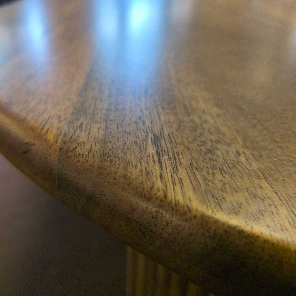 Close-up of a wooden surface with visible grain and texture