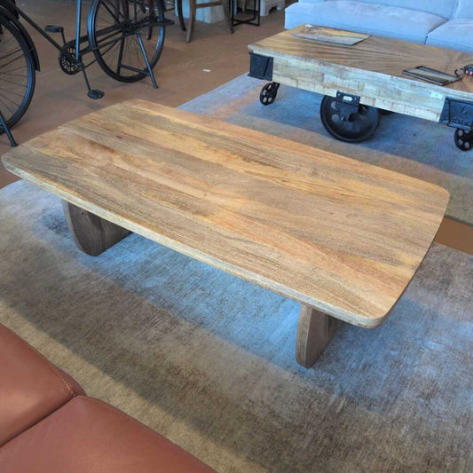Wooden coffee table with wheels in a room setting