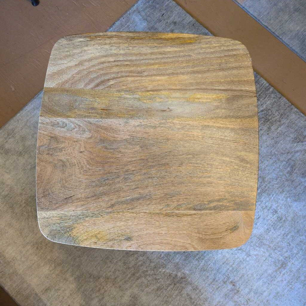 Wooden cutting board on a gray surface
