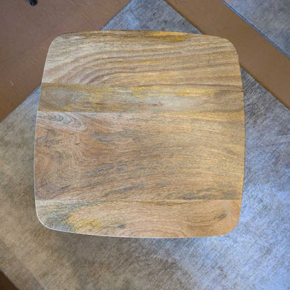 Wooden cutting board on a gray surface