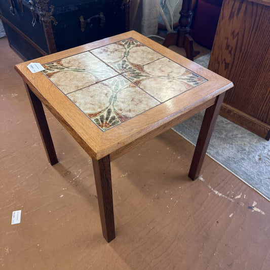 Wooden table with a tiled top in a room setting