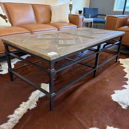 Coffee table with a herringbone pattern in a living room setting