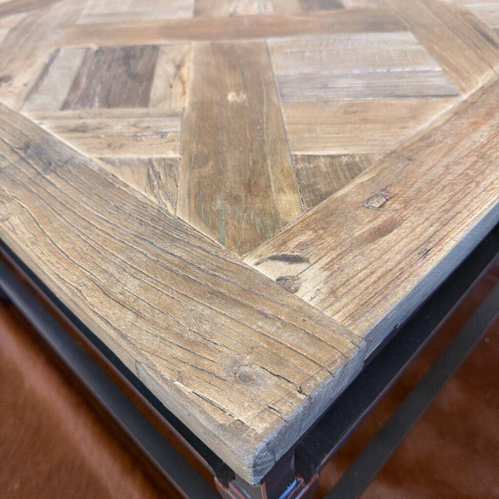 Close-up of a wooden table with a herringbone pattern