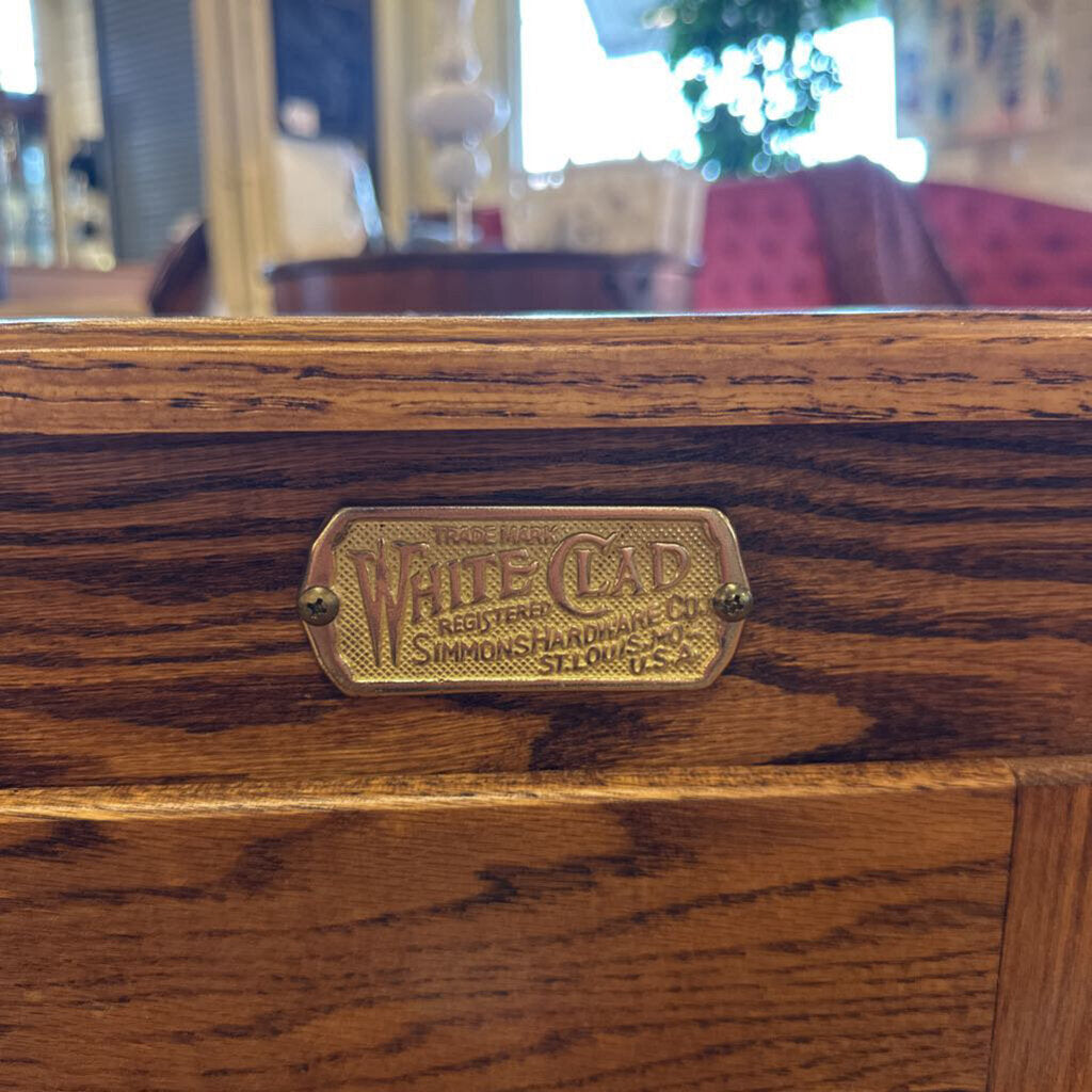 Wooden product with a brass label featuring 'White Chad' branding.