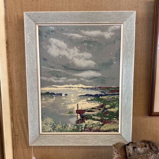 Framed painting of a landscape with a boat on a grassy area.