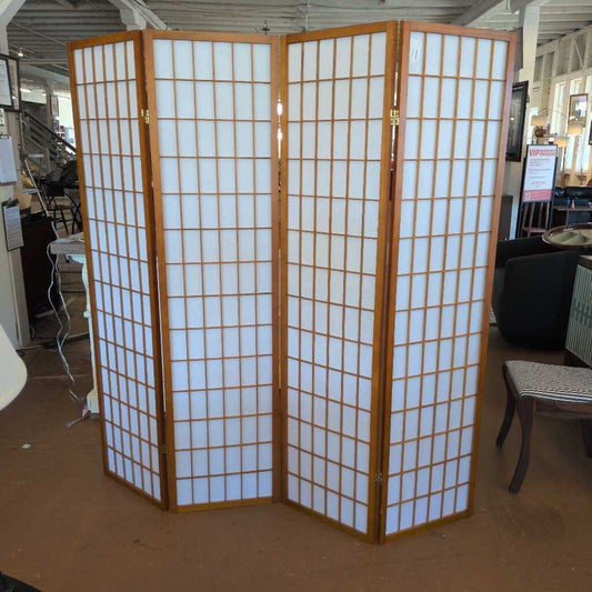 Wooden room divider with white panels in a store setting