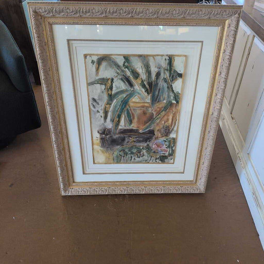 Framed painting on a table