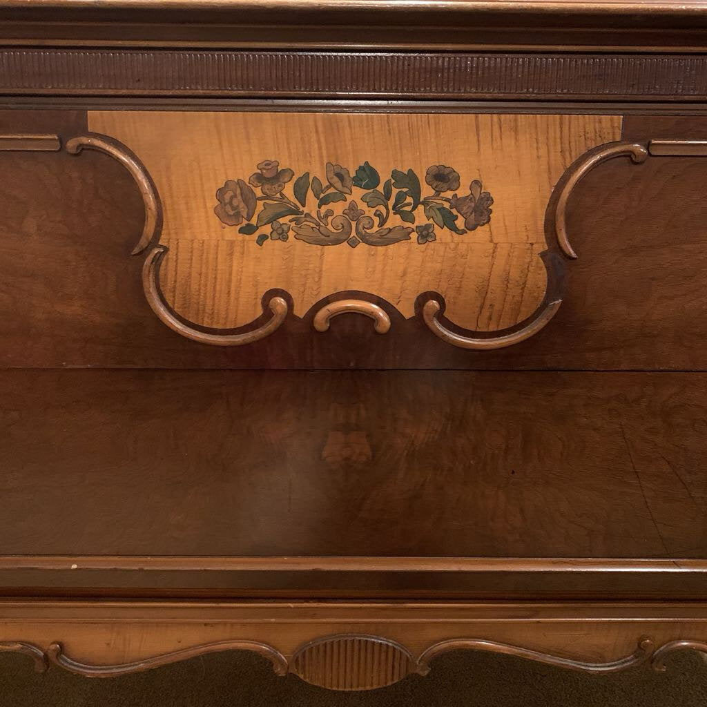 Close-up of a wooden piece with floral carvings