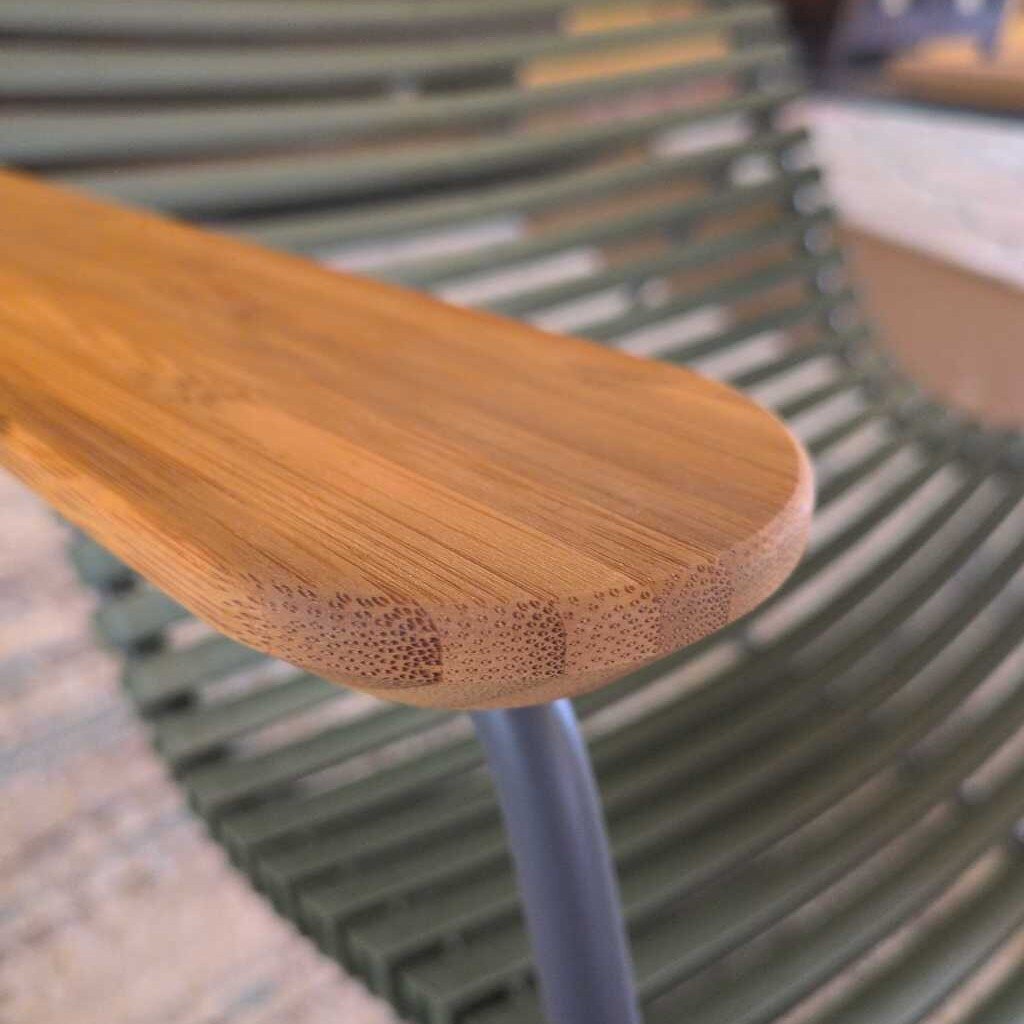 Close-up of a chair with wooden seat and metal frame
