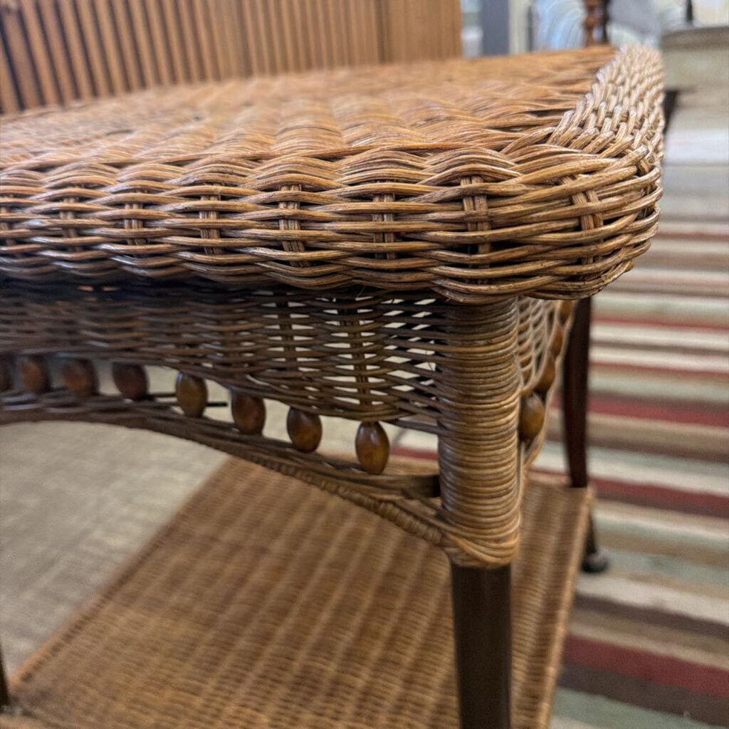 Close-up of a wicker chair with a blurred background