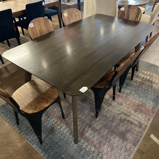 Dining table with chairs in a showroom setting