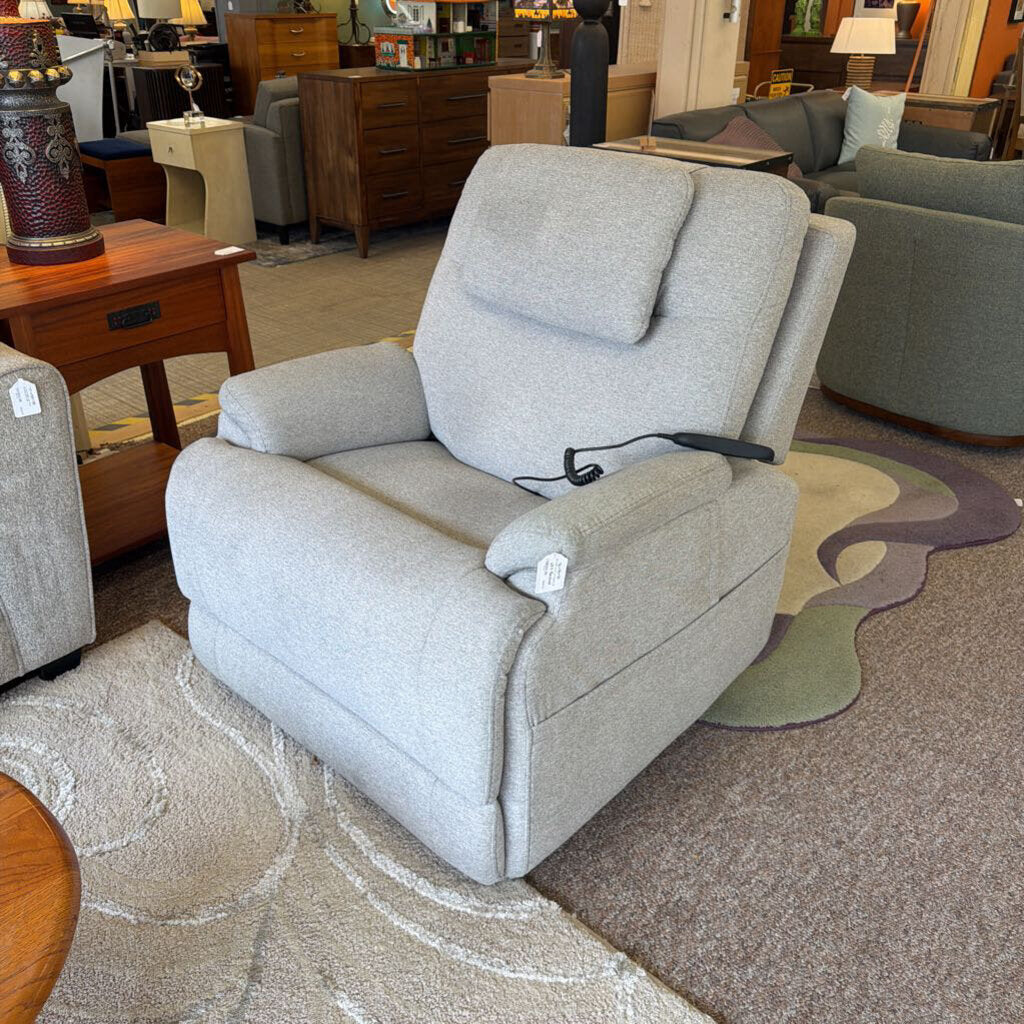 Gray recliner chair in a furniture store setting
