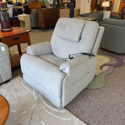 Gray recliner chair in a furniture store setting