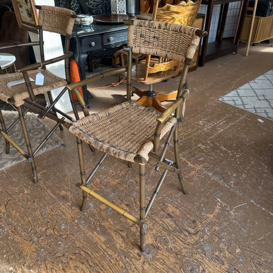 Wicker bar stools on a wooden floor with a rug