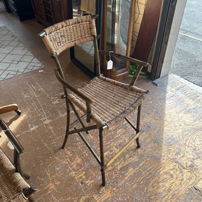 Woven chair with metal frame on a wooden floor