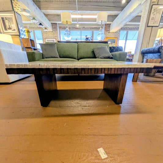 Green sofa with wooden coffee table in a living room setting