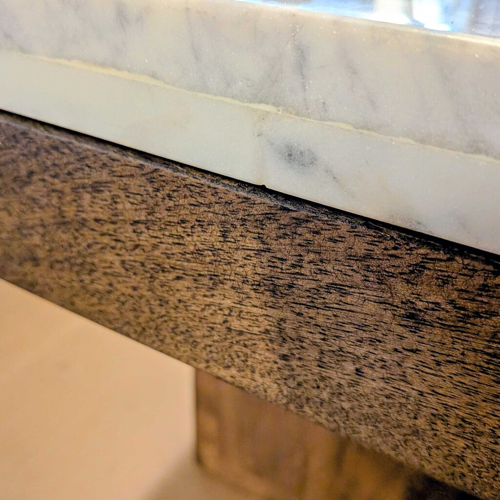 Close-up of a marble and wood surface