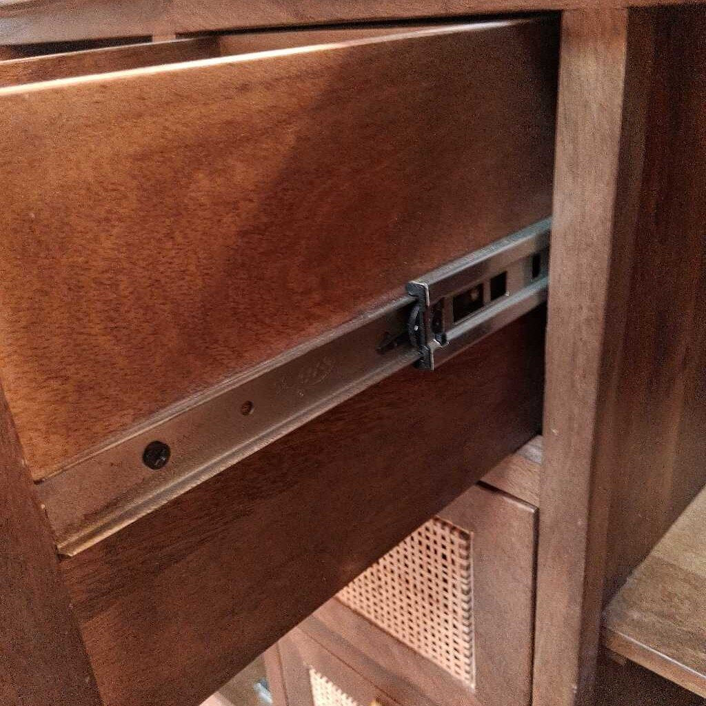 Wooden drawer with metal slide mechanism