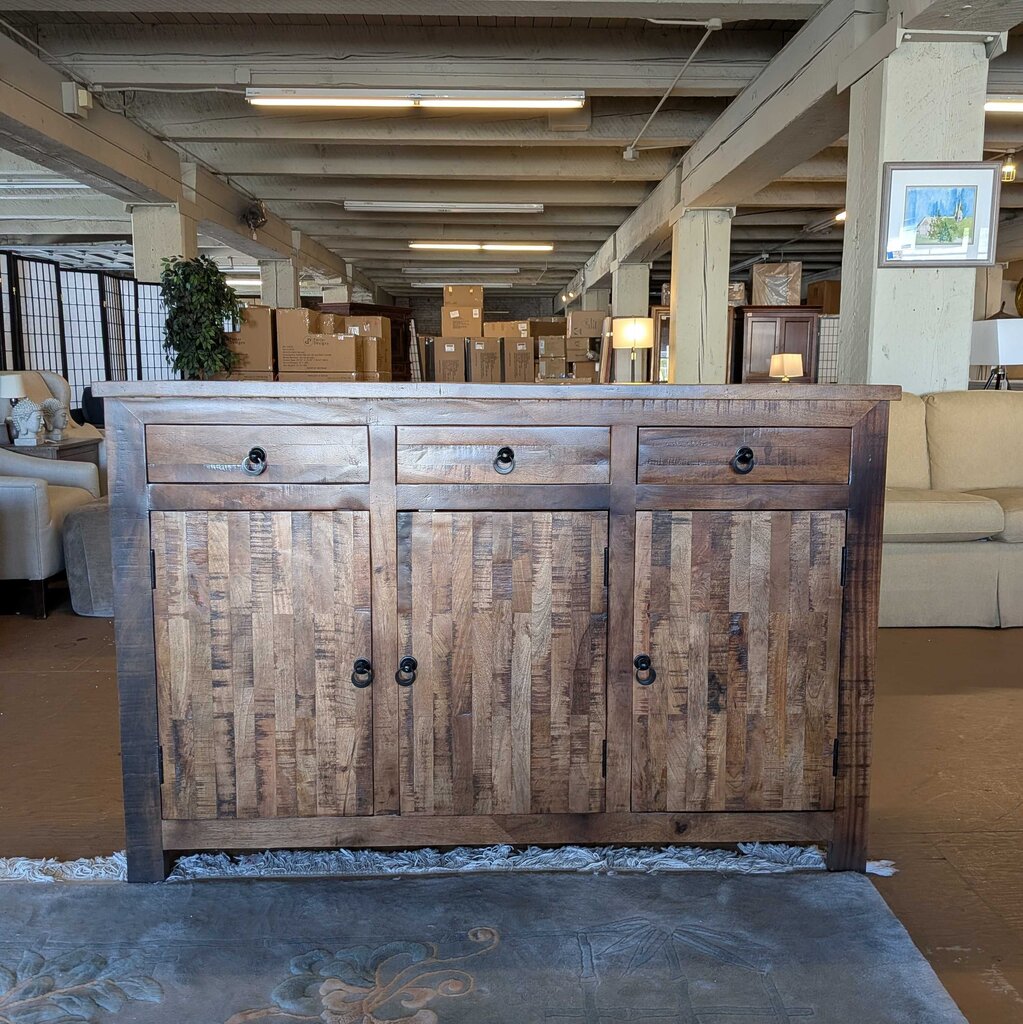 Wooden cabinet with three drawers and doors in a showroom setting