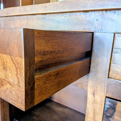 Close-up of a wooden drawer with a rustic finish