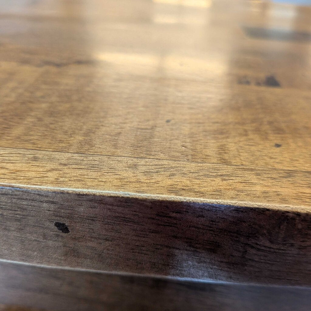 Close-up of a wooden surface with visible grain and texture