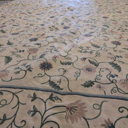 Close-up of a patterned rug with floral designs on a beige background