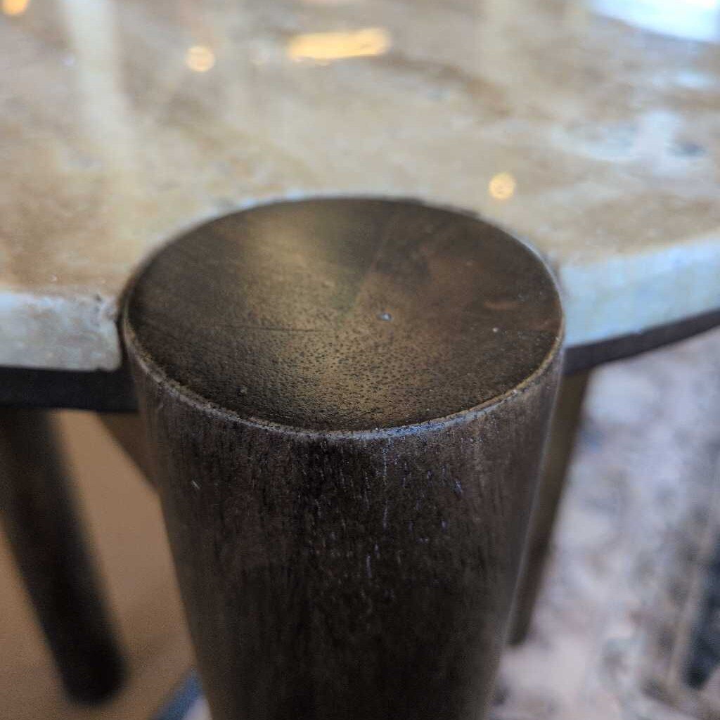 Close-up of a textured cylindrical object on a reflective surface
