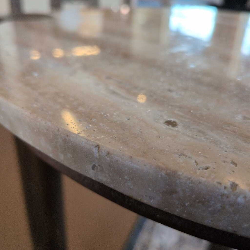 Close-up of a marble countertop with a blurred background