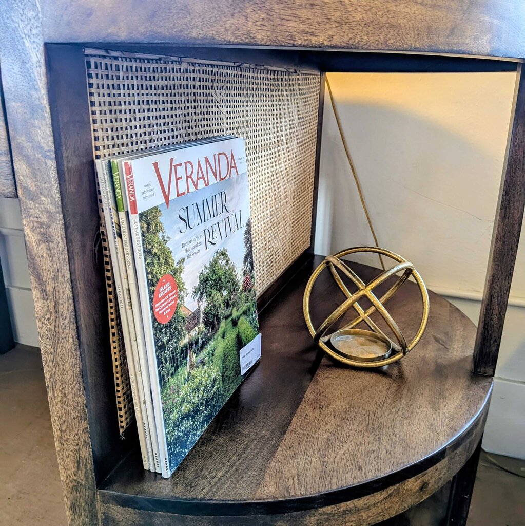 Wooden shelf with a 'Veranda' magazine and decorative sphere