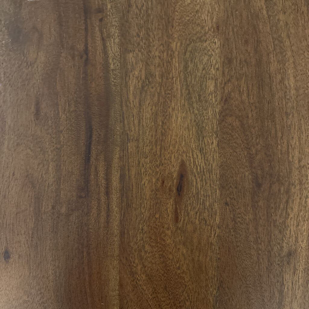 Close-up of a wooden surface with a rich brown color and visible grain.