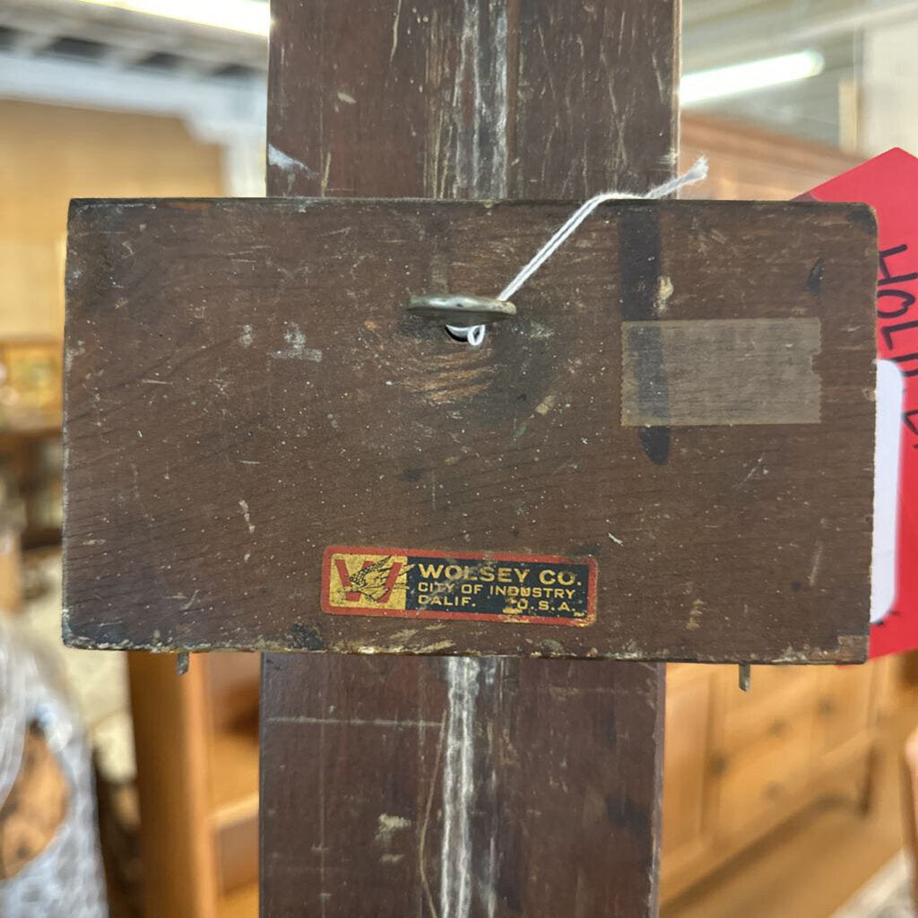 Vintage wooden stand with a label on a blurred background