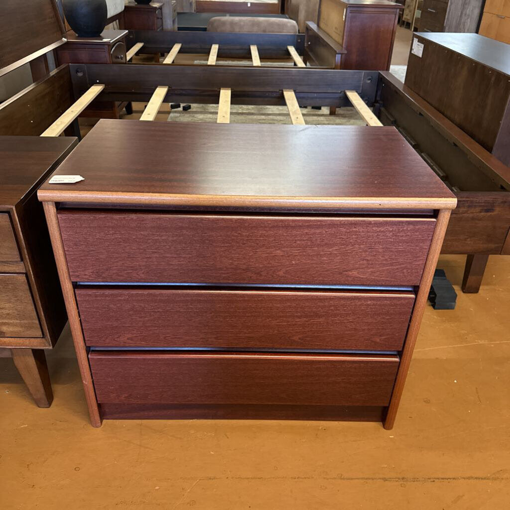 Wooden dresser with two drawers in a store setting