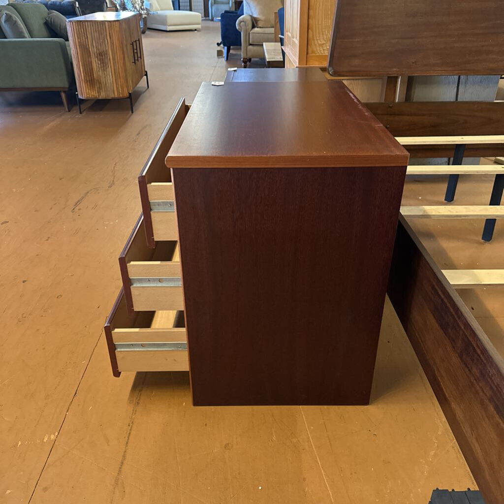 Wooden desk with drawers in a room setting