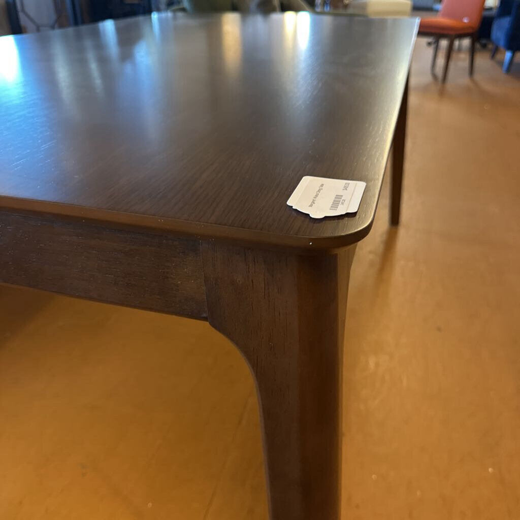 Wooden table with a price tag on a wooden floor