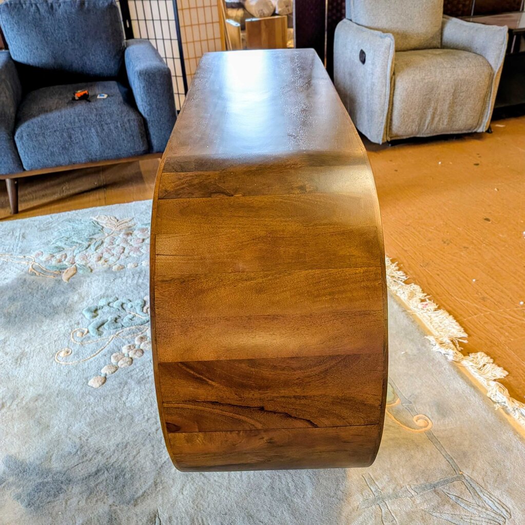 Wooden coffee table in a room with furniture and decor