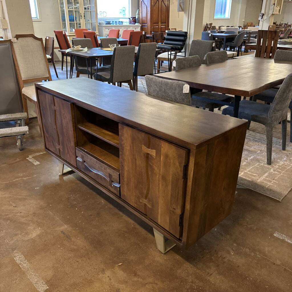 Wooden sideboard in a room with tables and chairs