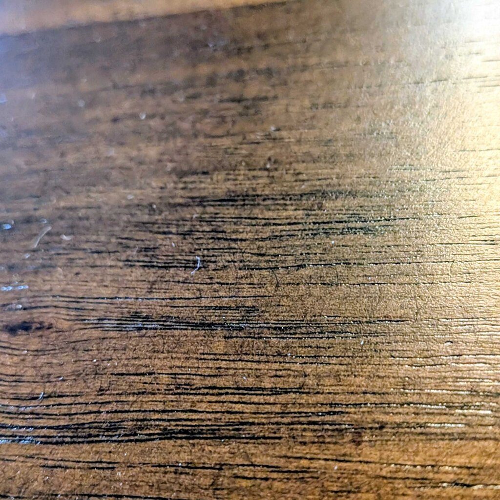 Wooden side table in a showroom with furniture in the background