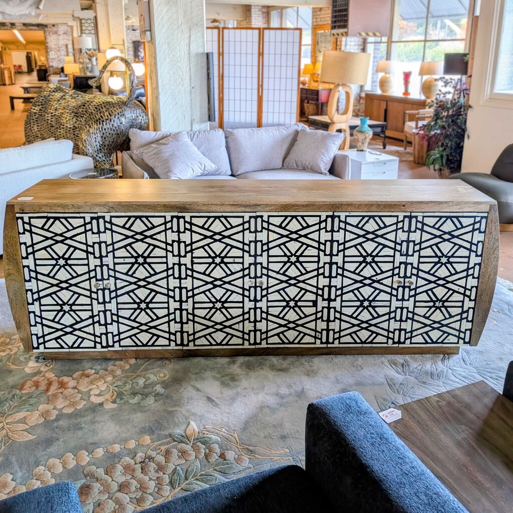Decorative wooden console table with geometric pattern in a living room setting