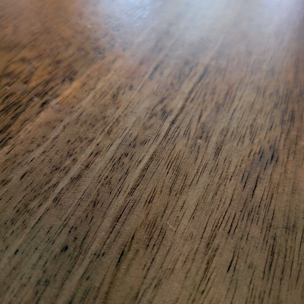 Close-up of a wooden surface with visible grain and texture