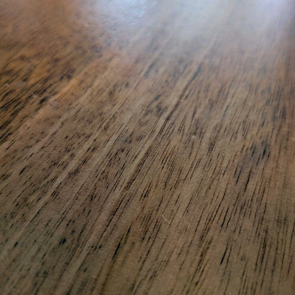 Close-up of a wooden surface with visible grain and texture