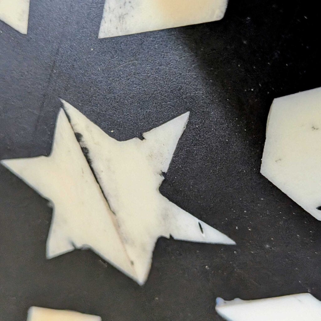 Star-shaped cookie cutters on a dark surface