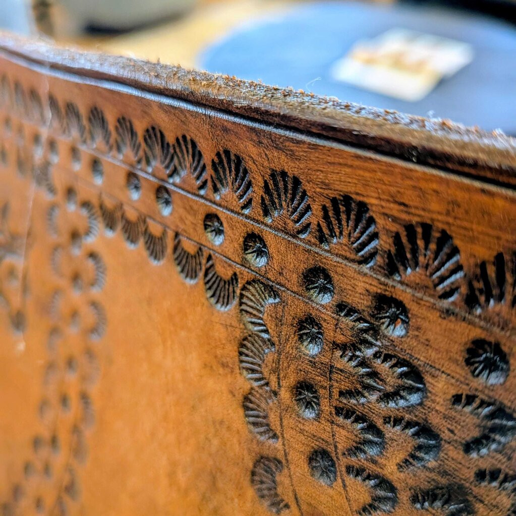 Close-up of a wooden surface with intricate carvings