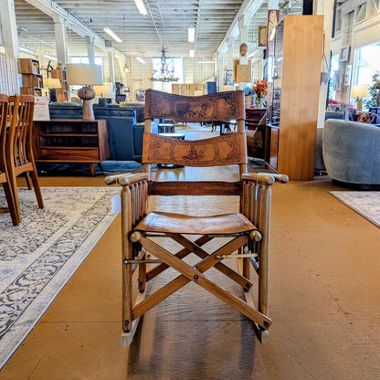 Wooden director's chair in a furniture store with various items in the background