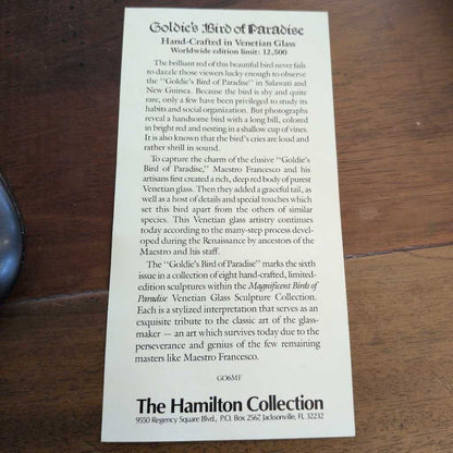 Brochure or informational sheet about Goldie's Bird of Paradise on a wooden surface