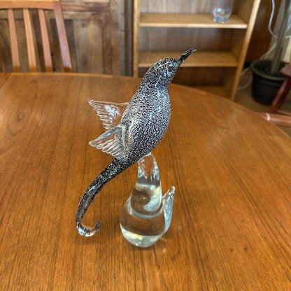 Decorative glass seahorse on a wooden table