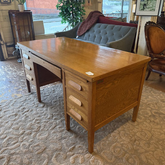 Wooden desk in a room with furniture and decor