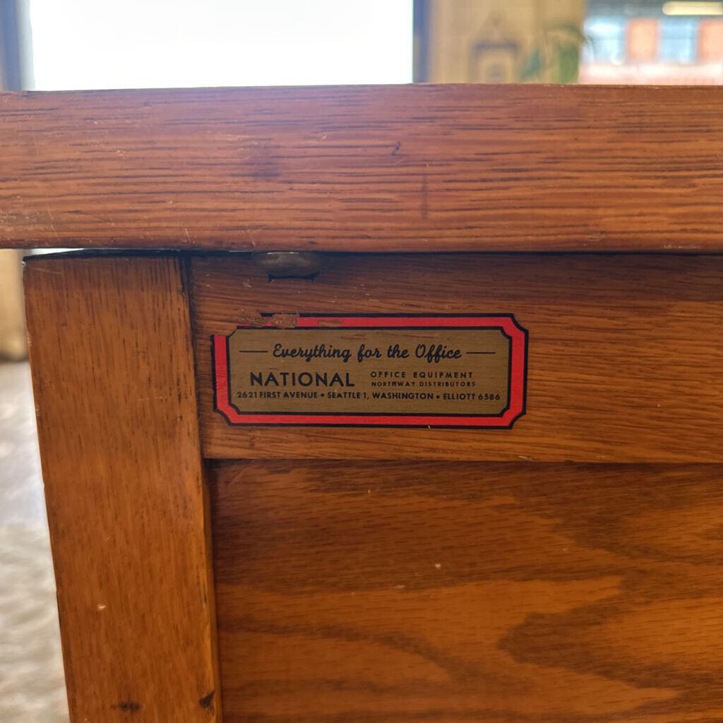 Wooden desk with a National Office Equipment label